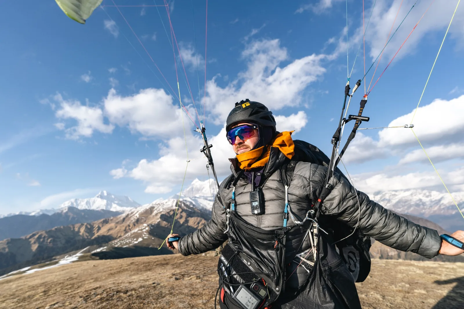 Paraglider preparing on a Himalayan ridge